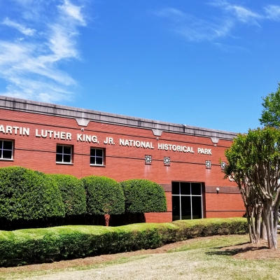 Martin Luther King Jr. National Historic Park with big brick building surrounded by bushes