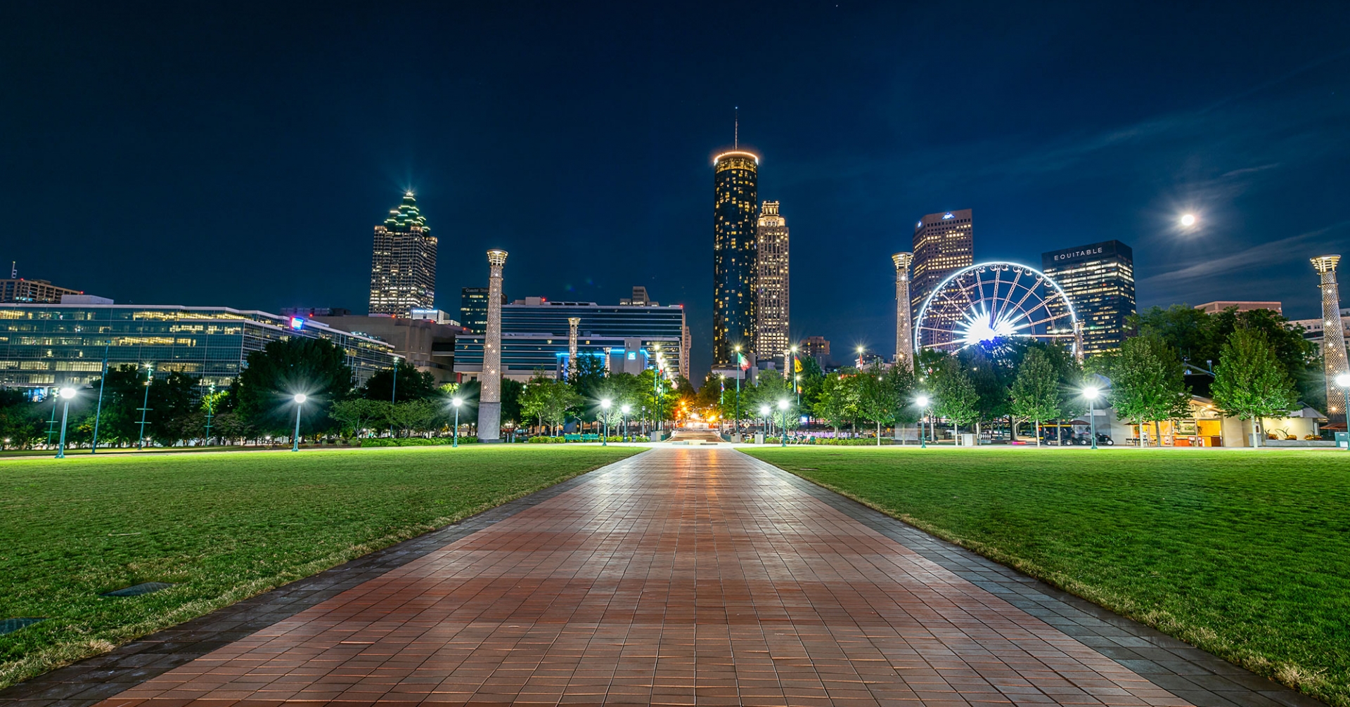 Night view of a city with buildings lighting up the sky