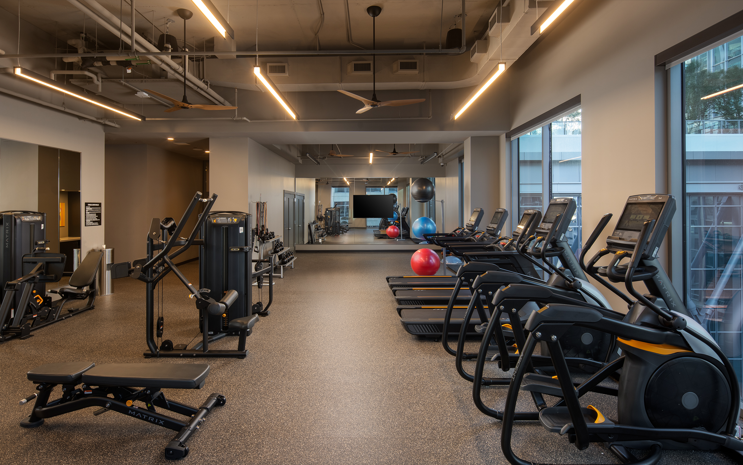 A gym with exercise equipment