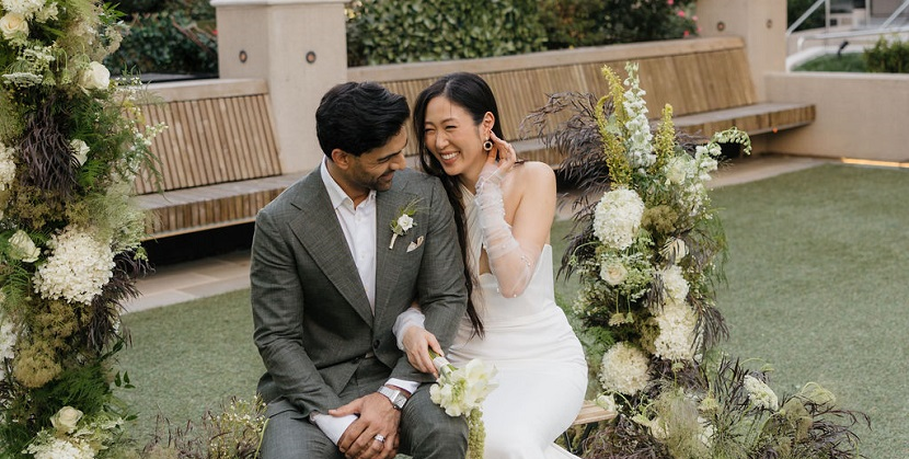A person and person sitting on a bench