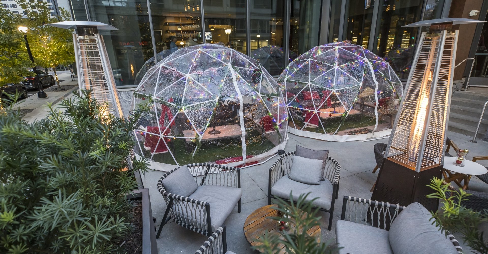 two igloo structures with holiday decor